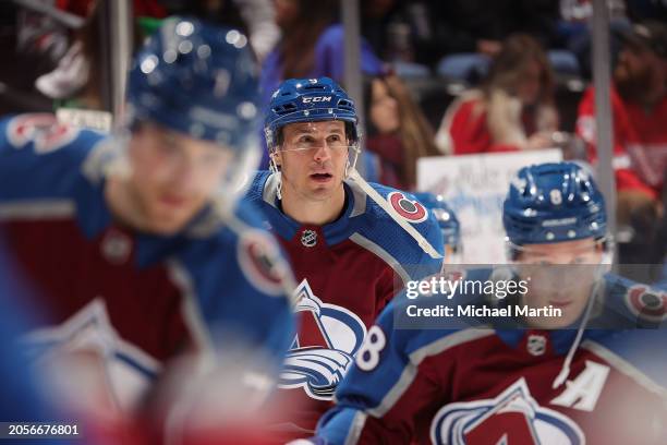 Devon Toews, Zach Parise and Cale Makar of the Colorado Avalanche skate prior to the game against the Detroit Red Wings at Ball Arena on March 6,...