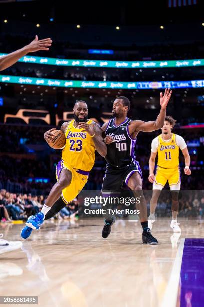 LeBron James of the Los Angeles Lakers drives to the basket during the game against the Sacramento Kings on March 6, 2024 NBAE at Crypto.Com Arena in...