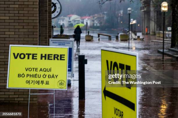 Nancy C., the name she wishes to use, leaves from voting as voters take to the polls for Super Tuesday elections at Lake Anne Plaza on March 5 in...