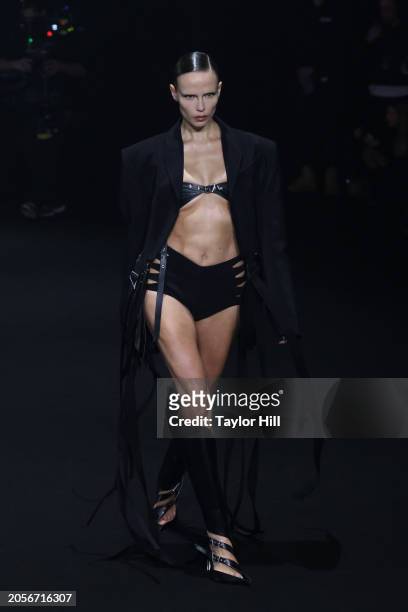 Natasha Poly walks the runway during the Mugler Womenswear Fall/Winter 2024-2025 show as part of Paris Fashion Week at Lycee Carnot on March 03, 2024...
