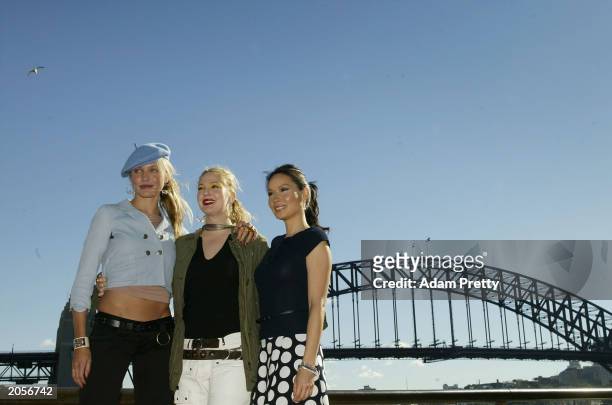 Actors Cameron Diaz, Drew Barrymore and Lucy Liu pose in front of the Sydney Harbour bridge during the Charlies Angels Full Throttle photocall at the...
