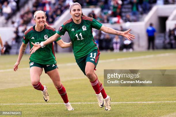 Jacqueline Ovalle of Mexico celebrates with Mayra Pelayo-Bernal after scoring the third goal of the game during the second half against Paraguay at...