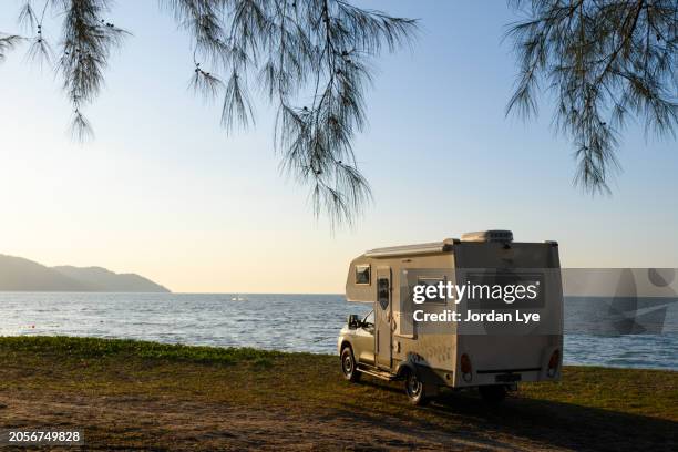 camper van by the sea - camper trailer stock pictures, royalty-free photos & images