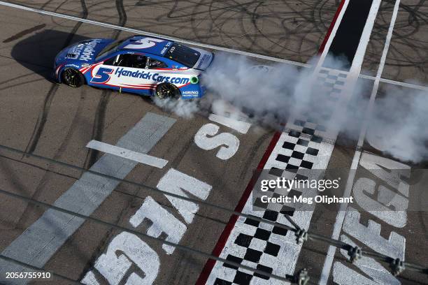 Kyle Larson, driver of the HendrickCars.com Chevrolet, celebrates with a burnout after winning the NASCAR Cup Series Pennzoil 400 at Las Vegas Motor...