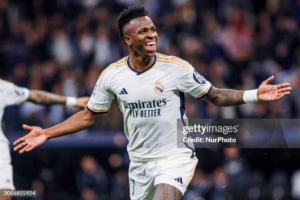 Vinicius Junior of Real Madrid CF is celebrating his goal during the Champions League match between Real Madrid and RB Leipzig at Santiago Bernabeu...