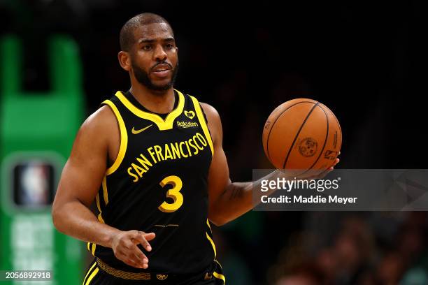 Chris Paul of the Golden State Warriors dribbles against the Boston Celtics during the second half at TD Garden on March 03, 2024 in Boston,...