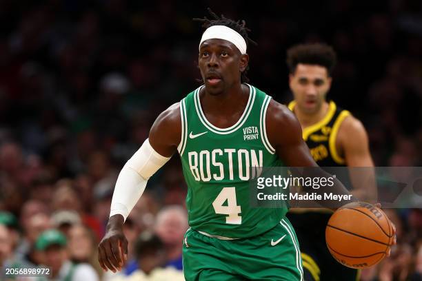 Jrue Holiday of the Boston Celtics dribbles against the Golden State Warriors during the first quarter at TD Garden on March 03, 2024 in Boston,...