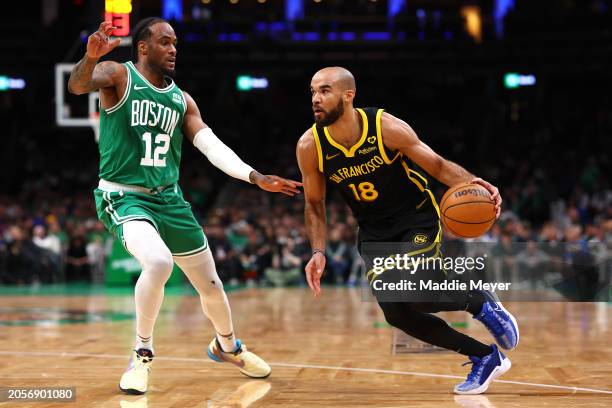 Oshae Brissett of the Boston Celtics defends Jerome Robinson of the Golden State Warriors during the second half at TD Garden on March 03, 2024 in...