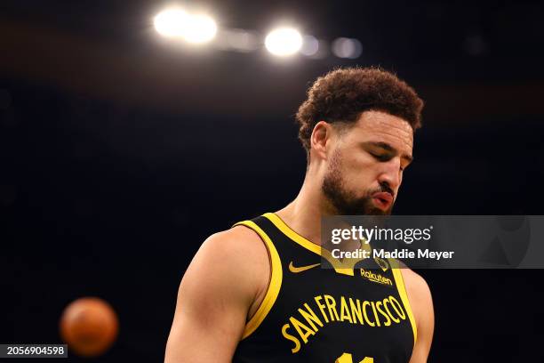 Klay Thompson of the Golden State Warriors reacts during the first quarter of the game against the Boston Celtics at TD Garden on March 03, 2024 in...