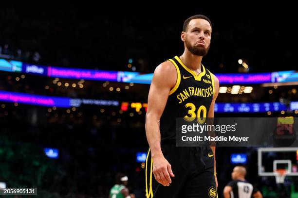 Stephen Curry of the Golden State Warriors walks to the locker room at half time during the game against the Boston Celtics at TD Garden on March 03,...