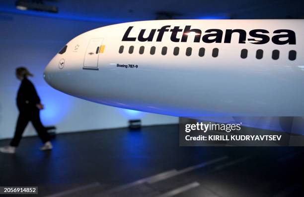 Model airplane of German airline Lufthansa is pictured at the company's headquarters in Frankfurt am Main, western Germany, on March 7, 2024. German...