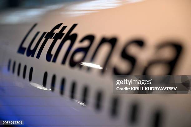 Model airplane of German airline Lufthansa is pictured at the company's headquarters in Frankfurt am Main, western Germany, on March 7, 2024. German...