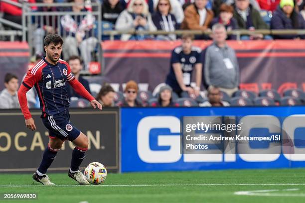 Carles Gil of New England Revolution looks to pass during a game between Toronto FC and New England Revolution at Gillette Stadium on March 3, 2024...