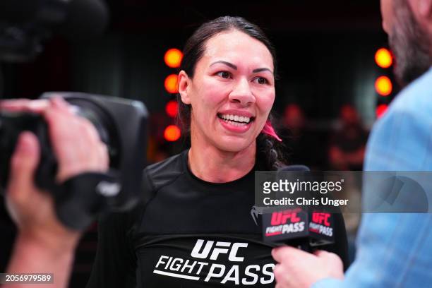 Raquel Canuto reacts after her submission victory against Karol Rosa during the UFC Fight Pass Invitational 6 at UFC APEX on March 03, 2024 in Las...
