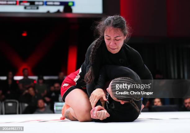Raquel Canuto grapples Karol Rosa during the UFC Fight Pass Invitational 6 at UFC APEX on March 03, 2024 in Las Vegas, Nevada.