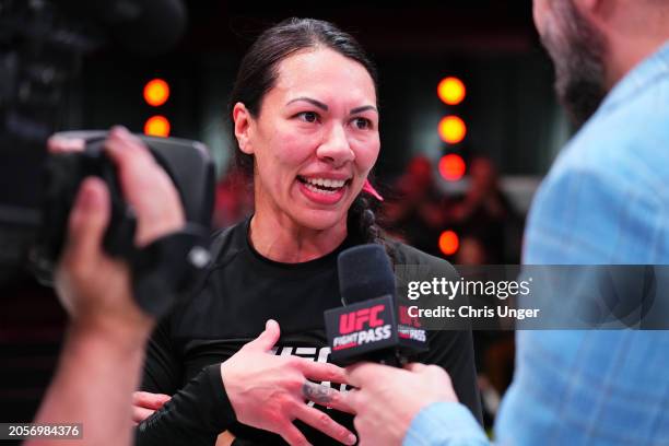 Raquel Canuto reacts after her submission victory against Karol Rosa during the UFC Fight Pass Invitational 6 at UFC APEX on March 03, 2024 in Las...