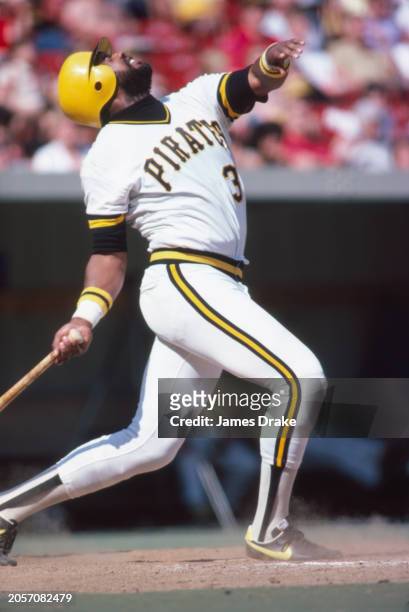 Pittsburgh Pirates right-fielder and All-Star Dave Parker eyes a fly ball while at bat during a game against the St. Louis Cardinals in April of 1980...