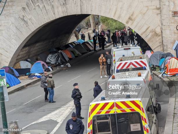 The Paris Prefecture of Police works on the evacuation of several camps on the banks of the Seine due to the flooding of the Seine River in Paris,...
