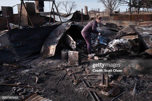 Angie Hodges searches for items in the remains of her home after it was destroyed by the Smokehouse Creek fire on March 03, 2024 near Stinnett,...