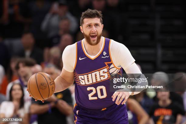 Jusuf Nurkic of the Phoenix Suns handles the ball during the first half of the NBA game at Footprint Center on March 03, 2024 in Phoenix, Arizona....