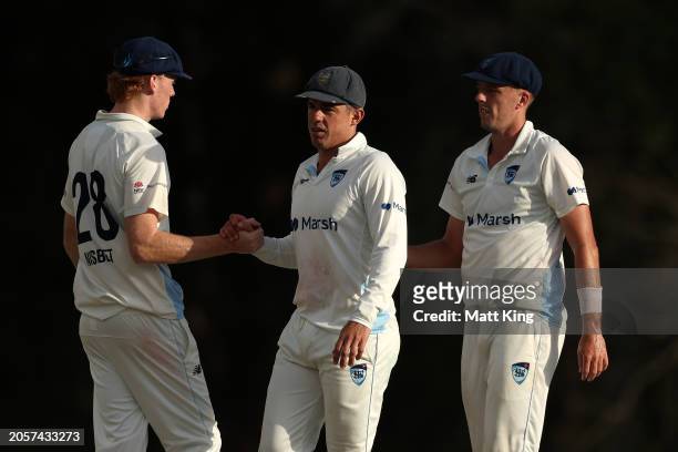 Moises Henriques, captain of New South Wales shakes hands with team mates after the match was called a draw during the Sheffield Shield match between...