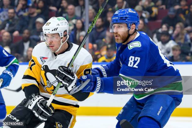 Ian Cole of the Vancouver Canucks defends against Sidney Crosby of the Pittsburgh Penguins during the third period of their NHL game at Rogers Arena...