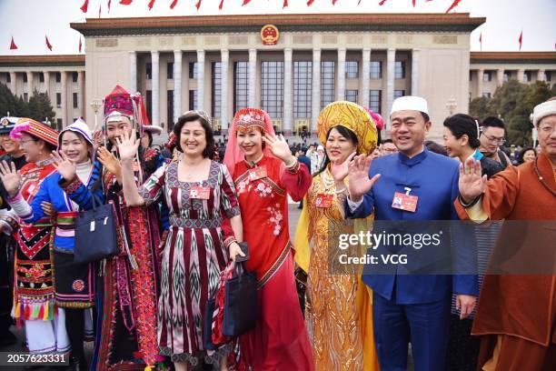 Members of the 14th National Committee of the Chinese People's Political Consultative Conference pose for a group photo in front of the Great Hall of...