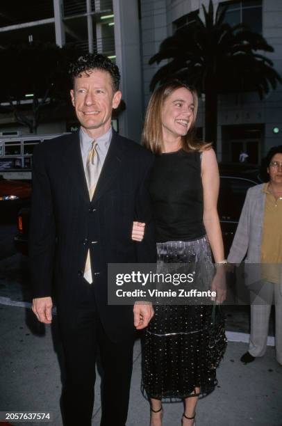 American musician Lyle Lovett and girlfriend April Kimble attend the premiere of Don Roos' 'The Opposite of Sex' at Laemmle's Monica 4-plex in Santa...