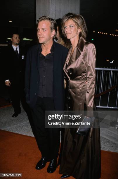 Canadian actor Kiefer Sutherland and wife Kelly Winn attend the premiere of Alex Proyas' 'Dark City', Century City, California, 25th February 1998.