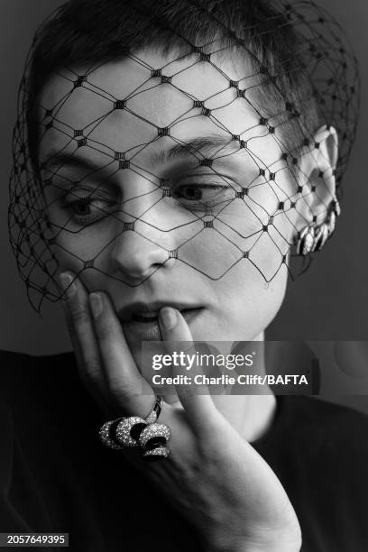 Actor Emma Corrin is photographed backstage at the 2024 EE BAFTA Film Awards, held at The Royal Festival Hall on February 18, 2024 in London, England.