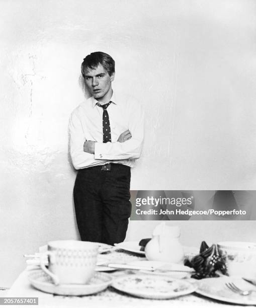 English singer and actor Adam Faith posed inside a flat in King's Cross, London in 1960.