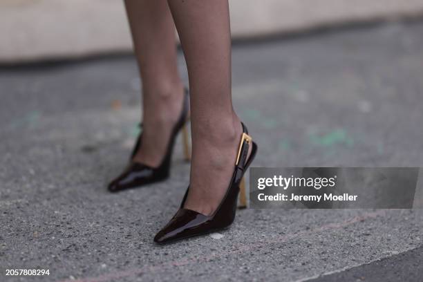 Berna Bilbey seen wearing brown tights and YSL dark brown / gold pumps / heels, during the Womenswear Fall/Winter 2024/2025 as part of Paris Fashion...