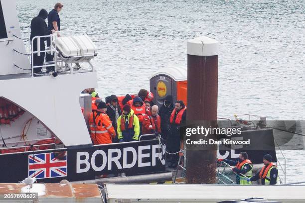 Migrants are brought into Dover Port by Border Force officials after being picked up in the English Channel while trying to make the journey from...