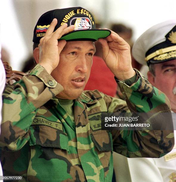 The Venezuelan candidate for presidency, Hugo Chavez, dons a hat during a military act in the Simon bolivar school in La Guaira, Venezuela, 20 May...