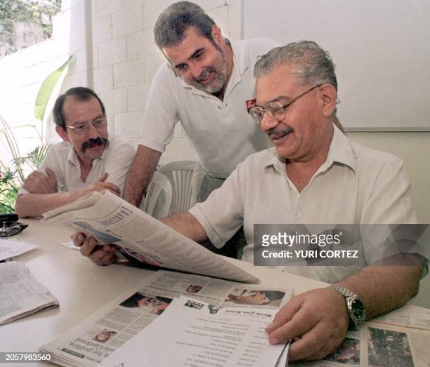 The candidate for mayro in San Salvador for the Farabundo Marti party front for National Liberation, Hector Silva , looks at periodicles and dates...
