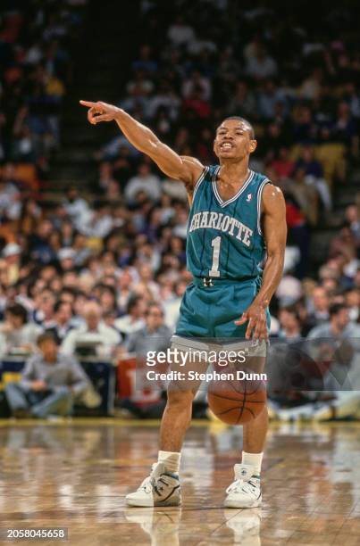Muggsy Bogues, Point Guard for the Charlotte Hornets points down court during the NBA Pacific Division basketball game against the Los Angeles Lakers...