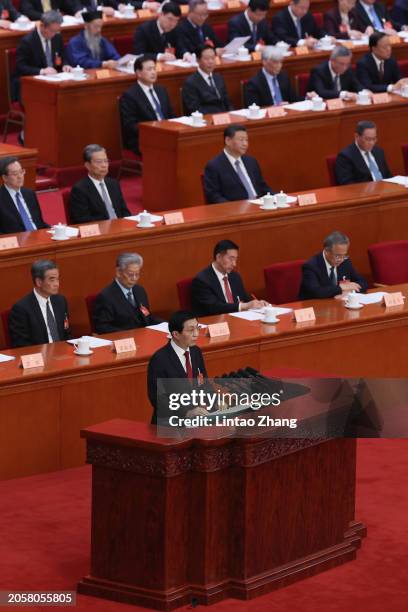 Wang Huning, a member of the Standing Committee of the Political Bureau of the Communist Party of China CPC Central Committee delivers his report...