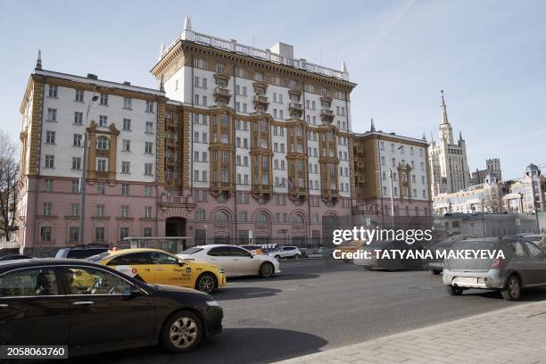 Cars ride past the US embassy building in Moscow, on March 7, 2024. Russia summoned the US ambassador on March 7, 2024 to protest against what it...