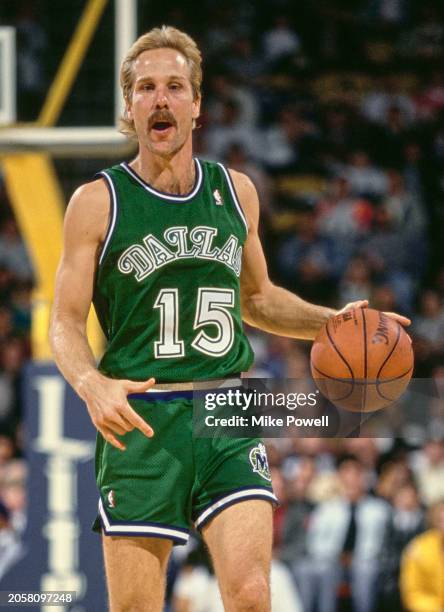 Brad Davis, Point Guard for the Dallas Mavericks in motion dribbling the basketball down court during the NBA Pacific Division basketball game...