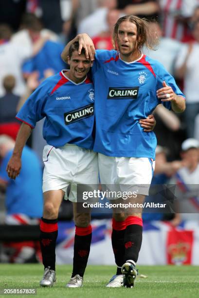 July 24: Dado Prso of Glasgow Rangers and Nacho Novo of Glasgow Rangers celebrate during the Pre Season Friendly match between Fulham and Glasgow...