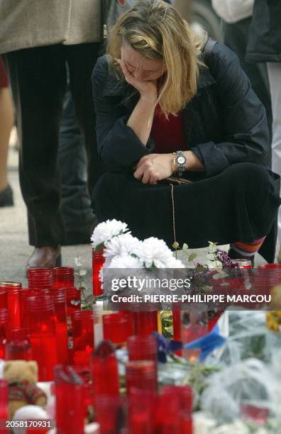 Woman meditates during a ceremony in memory of the victims of the blasts at Atocha train station, 18 March 2004 in Madrid, a week after March 11...