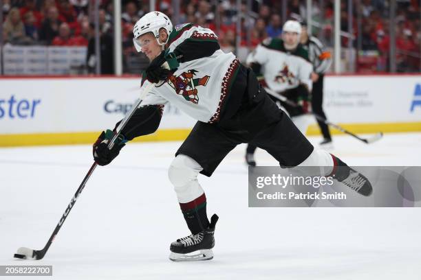 Nick Bjugstad of the Arizona Coyotes shoots against the Washington Capitals during the first period at Capital One Arena on March 03, 2024 in...