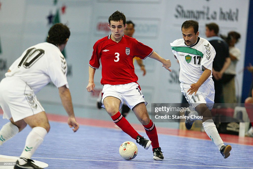 Paul Osborne Of England Tries To Get Pass Nurmatov Nigman #17 and Abduraimov Azamat Of Uzbekistan