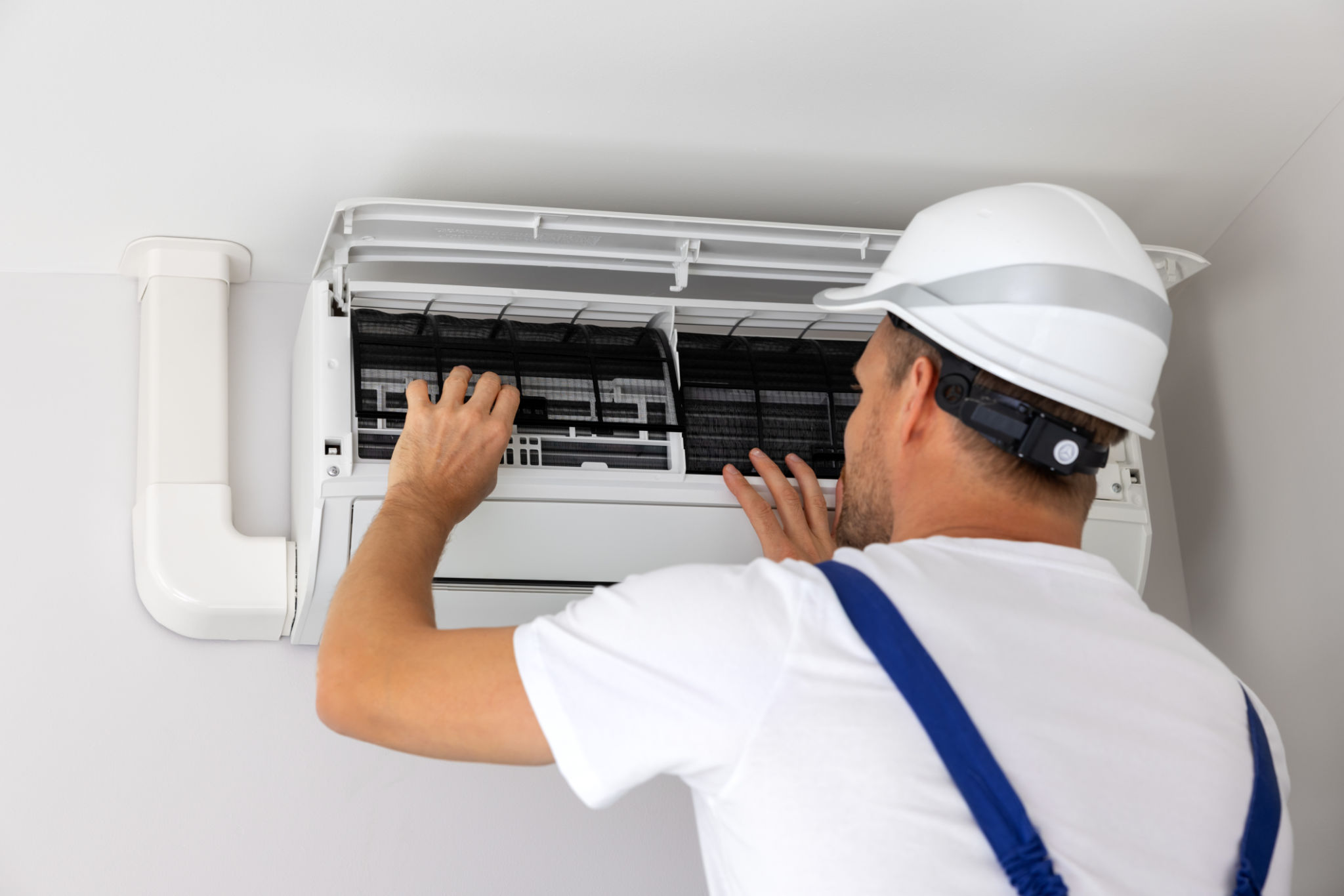 air conditioner maintenance and repair. hvac service technician at work air conditioner maintenance and repair. hvac service technician at work