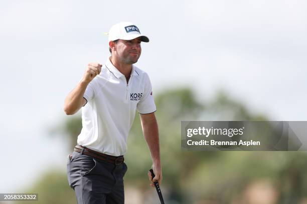 Austin Eckroat of the United States celebrates on the 18th green on his way to winning during the continuation of the weather delayed final round of...