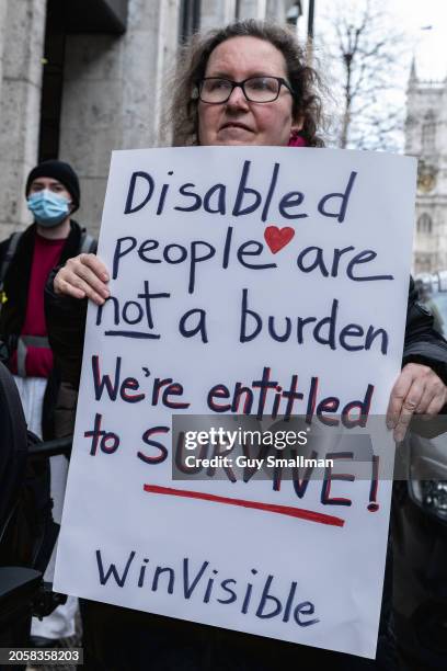 Supporters of Disabled People Against Cuts and Winvisible protest against deaths caused by benefit cuts and sanctions at Department For Work and...