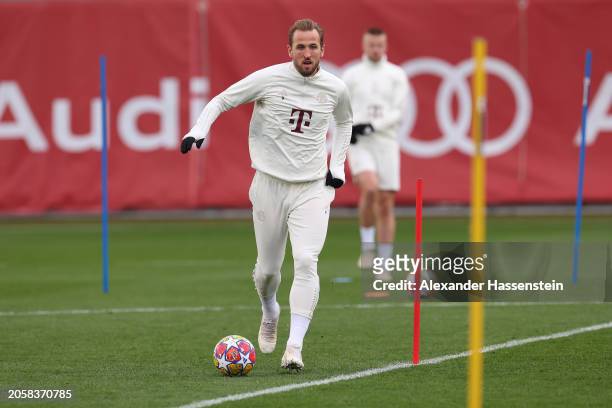 Harry Kane of FC Bayern München plays with the ball during a training session ahead of their UEFA Champions League Round of 16 second leg match at...
