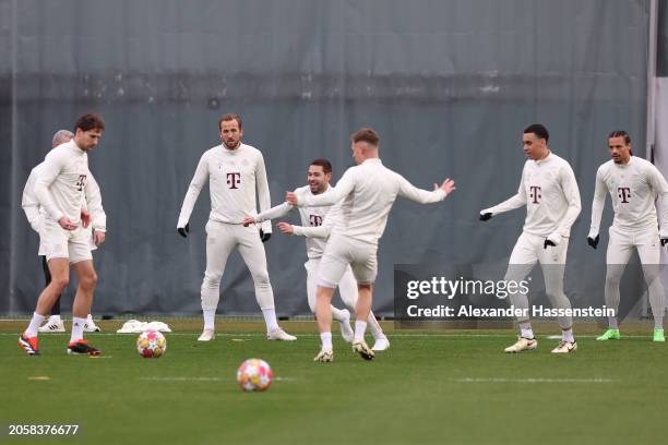 Leon Goretzka, Harry Kane, Raphael Guerreiro, Joshua Kimmich, Jamal Musiala and Leroy Sane of FC Bayern München play with the ball during a training...