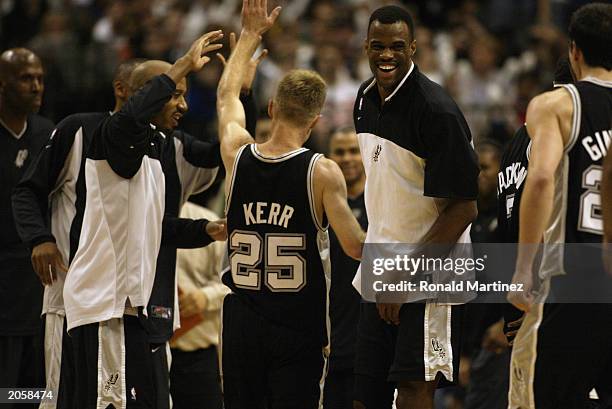 Steve Kerr is congratulated Bruce Bowen and David Robinson of the San Antonio Spurs in Game six of the Western Conference Finals during the 2003 NBA...
