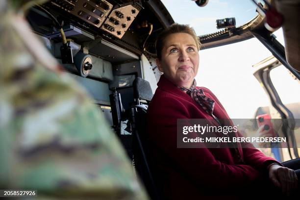 Danish Prime Minister Mette Frederiksen sits in a helicopter during a visit to Air Base Karup, the main air base of the Royal Danish Air Force, in...